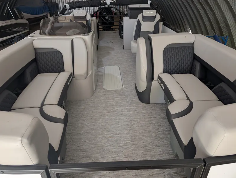 Slide: The Image of Interior of a 2026 Sylvan L3 LZ DH with gray and black seating. - 8