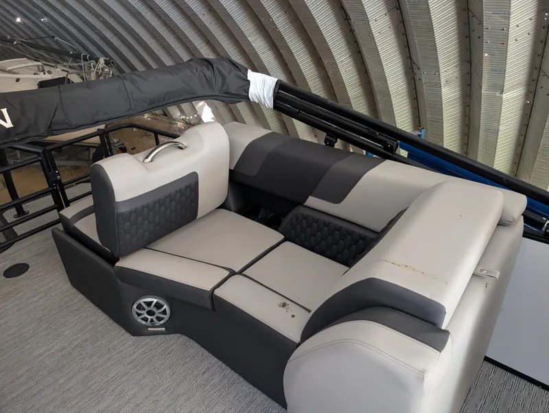 Slide: The Image of The image shows a modern, cushioned seating area on a boat with gray and black upholstery. - 17