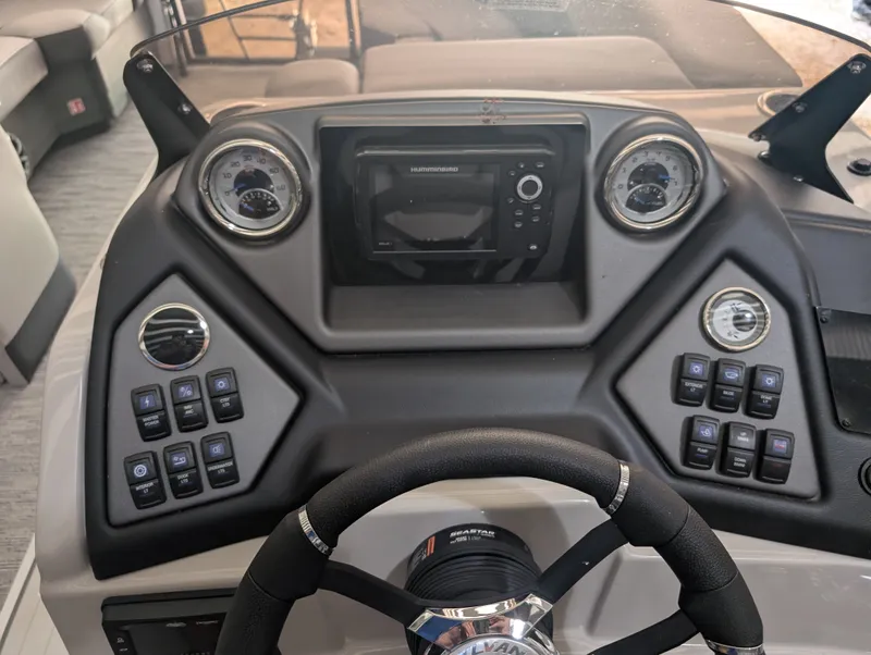 Slide: The Image of The image shows the dashboard of a Sylvan L3 LZ DH boat with modern instruments and controls. - 15