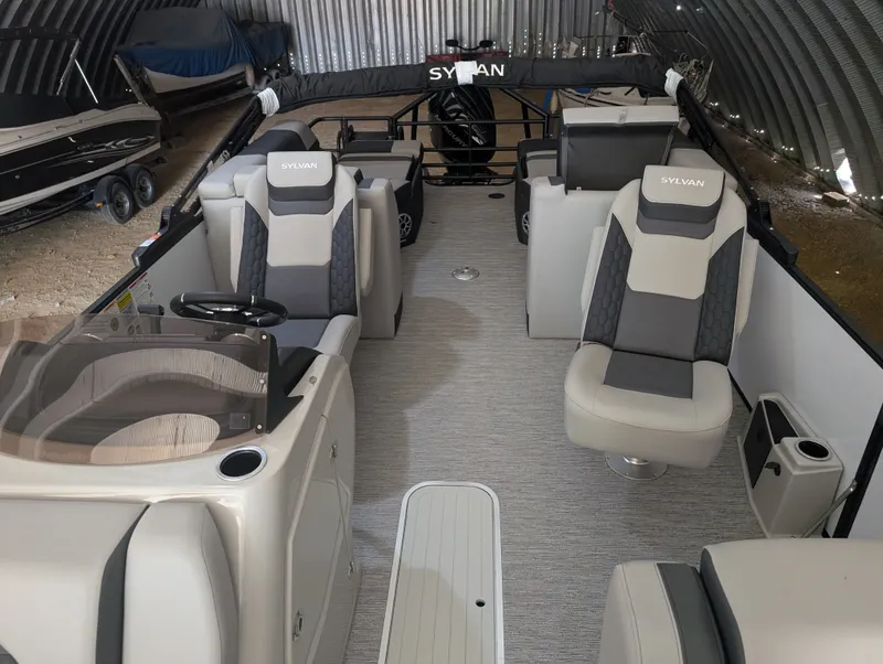 Slide: The Image of Interior of a Sylvan L3 LZ DH pontoon boat with gray and beige seating. - 11