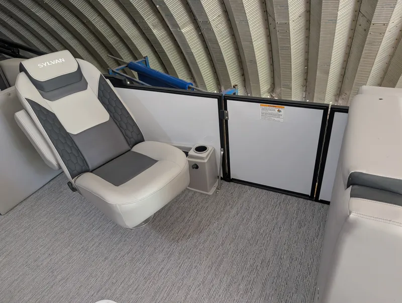 Slide: The Image of The 2026 Sylvan L3 LZ DH features a sleek seat with gray and white upholstery. - 12