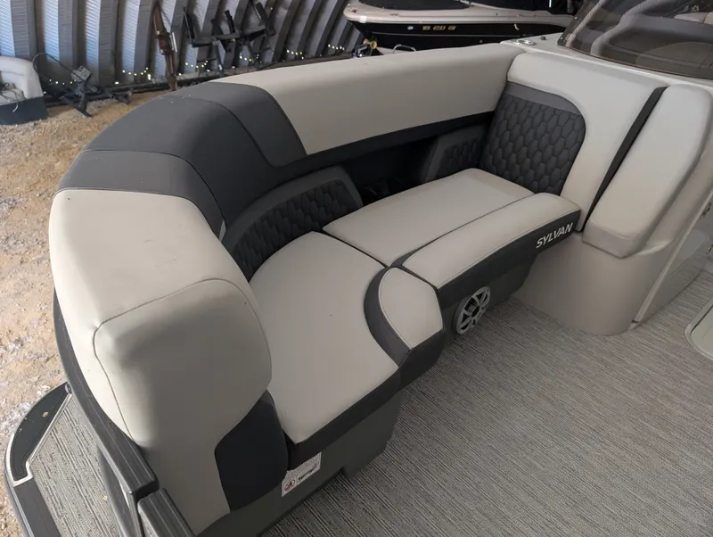 Slide: The Image of The image shows a sleek, cushioned seating area in a modern boat. - 10