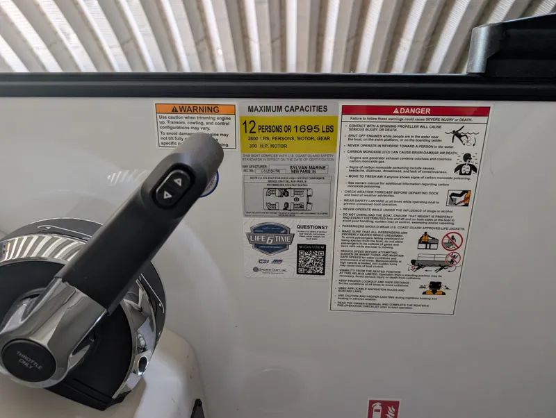 Slide: The Image of Close-up of the helm console with warning and capacity labels. - 16