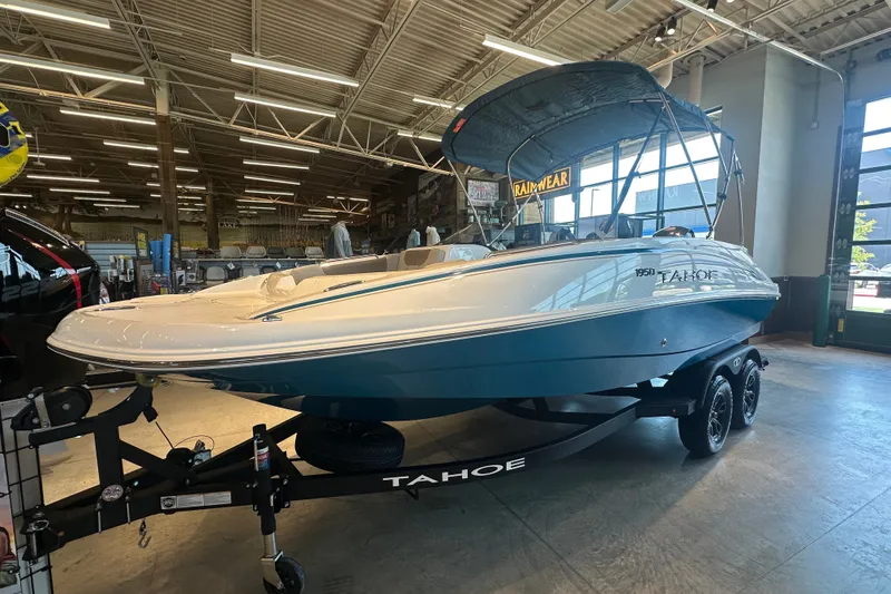 The Image of 2027 Tahoe 1950 boat displayed indoors on a trailer. - 2