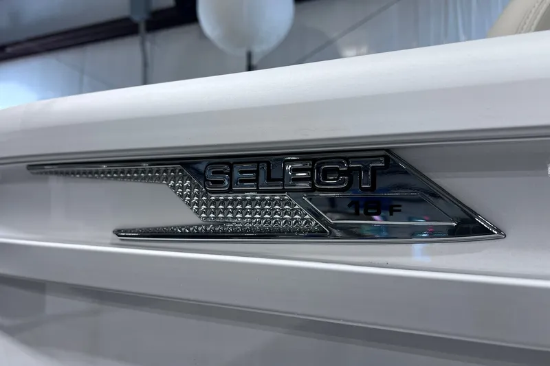 Slide: The Image of Close-up of 2026 SunCatcher Select 18F logo on a sleek white surface. - 31