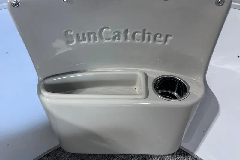 Slide: The Image of SunCatcher Select 18F 2026 boat console with cup holder and storage compartment. - 28