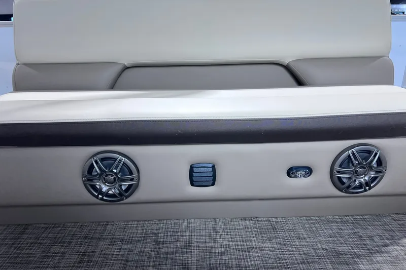 Slide: The Image of 2026 SunCatcher Select 18F boat interior with speakers and seating detail. - 17