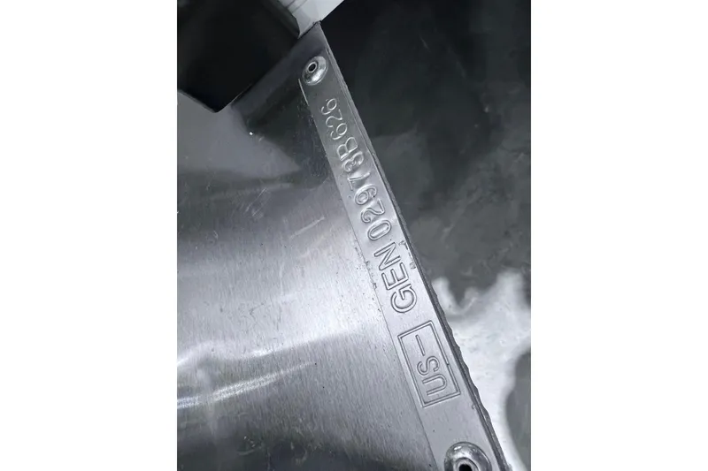 Slide: The Image of Close-up of SunCatcher Select 18F 2026 metal component with engraved serial number. - 36