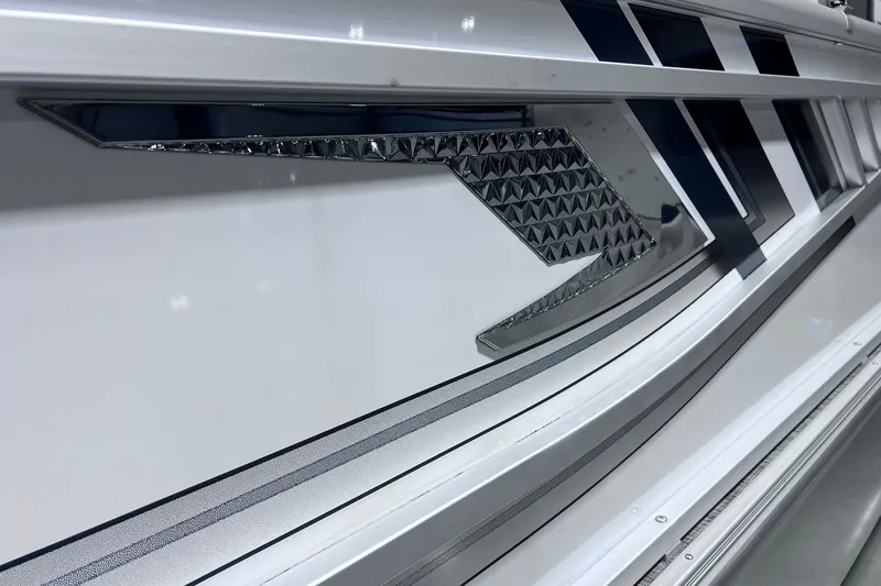 Slide: The Image of Close-up of 2026 SunCatcher Select 18F boat exterior with sleek design details. - 32