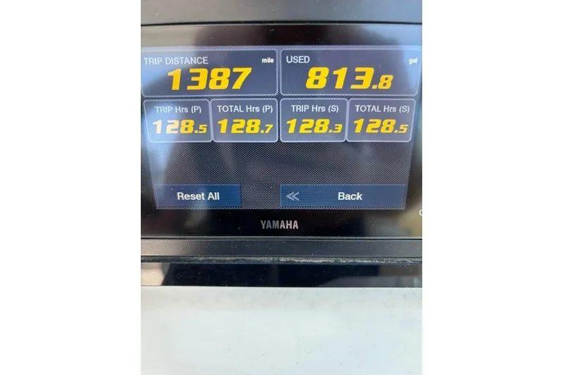 Slide: The Image of Display screen showing trip data: 1387 miles, 813.8 gallons used, Cobia 280 Dual Console 2022. - 9