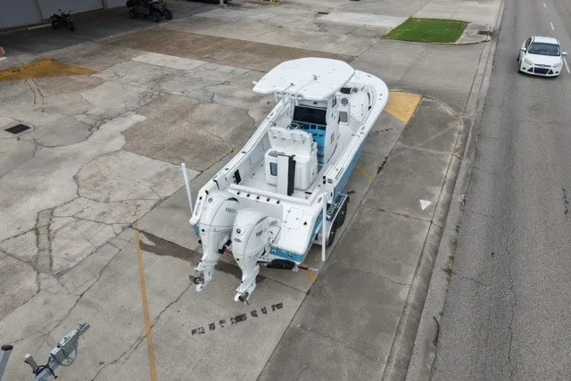 Slide: The Image of Aerial view of 2026 Tidewater 272 LXF boat on a trailer in an urban setting. - 5