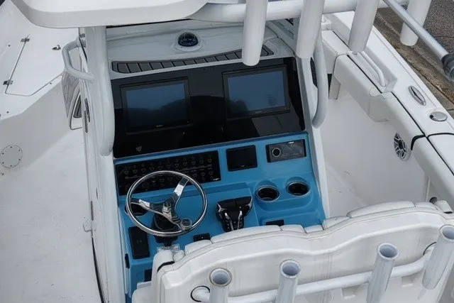 Slide: The Image of 2026 Tidewater 272 LXF boat cockpit with dual screens and modern controls. - 10