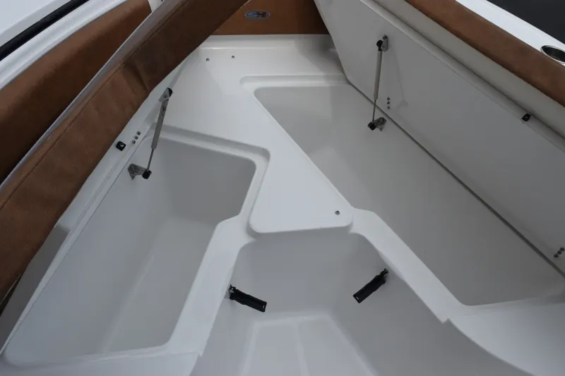 Slide: The Image of Interior view of 2027 Sea Hunt Ultra 235SE boat storage compartments. - 17