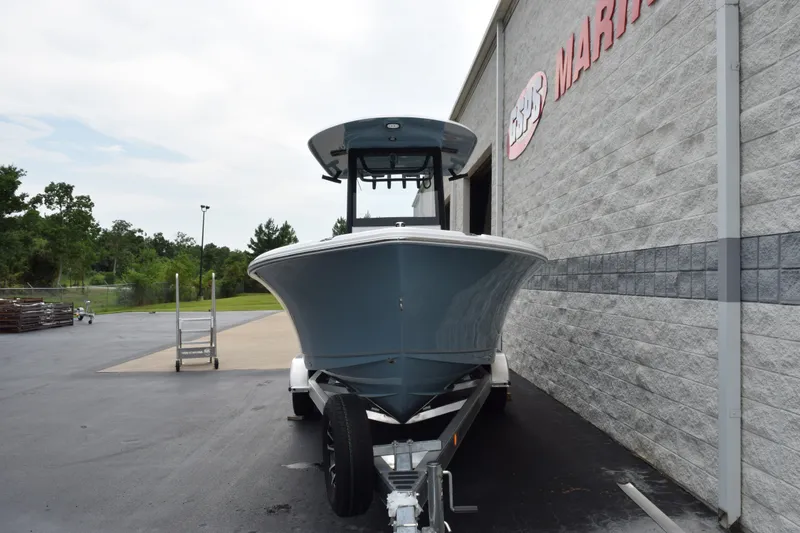 Slide: The Image of 2027 Sea Hunt Ultra 235SE boat on trailer outside marine dealership. - 3
