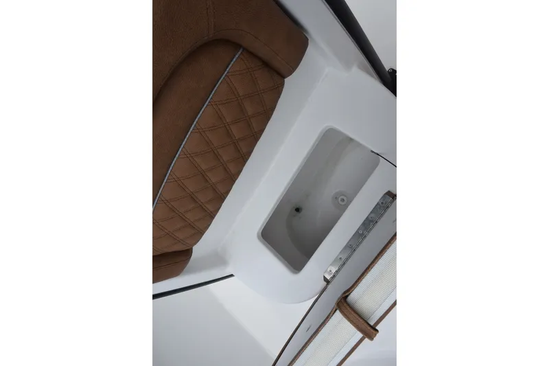 Slide: The Image of Interior view of 2027 Sea Hunt Ultra 235SE boat with brown cushioned seating. - 18