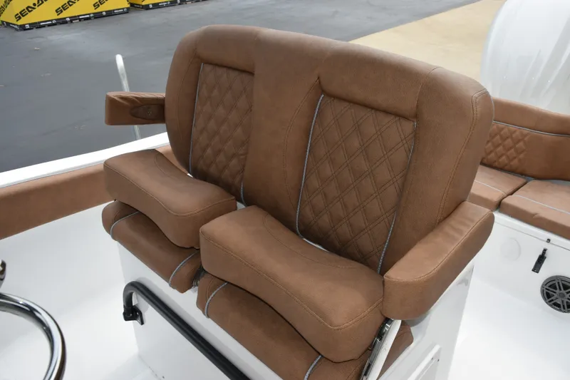 Slide: The Image of Luxurious brown seating on 2027 Sea Hunt Ultra 235SE boat, featuring diamond stitching. - 12