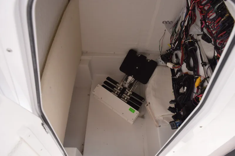 Slide: The Image of Interior wiring and components of a 2027 Sea Hunt Ultra 235SE boat. - 16