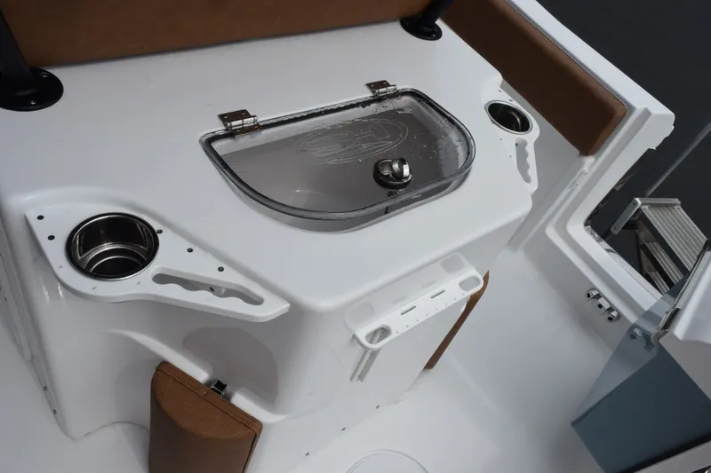 Slide: The Image of Interior view of 2027 Sea Hunt Ultra 235SE boat, featuring a sleek console design. - 10