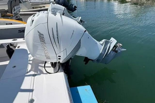 Slide: The Image of 2023 Everglades 253 Center Console boat with Mercury outboard engine at dock. - 17