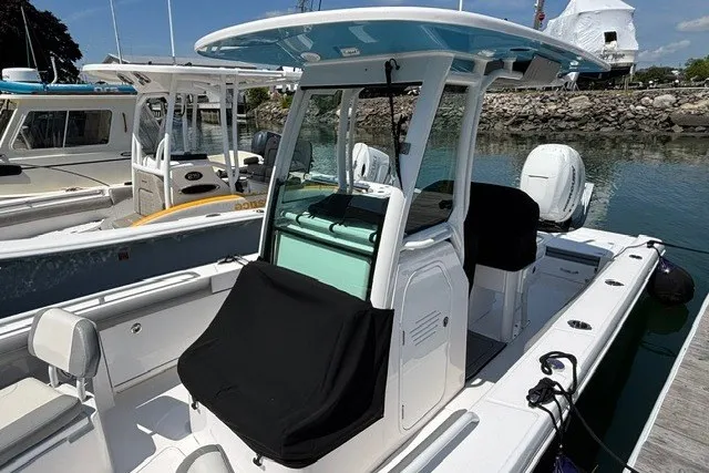 Slide: The Image of 2023 Everglades 253 Center Console boat docked, featuring sleek design and modern amenities. - 7