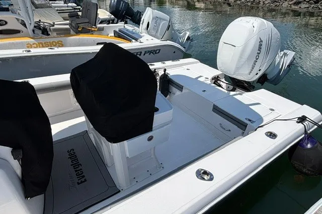 Slide: The Image of 2023 Everglades 253 Center Console boat with covered seats and Mercury outboard engine. - 4