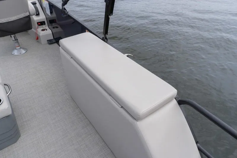 Slide: The Image of 2024 Sylvan L5 DLZ boat interior with seating and water view. - 6