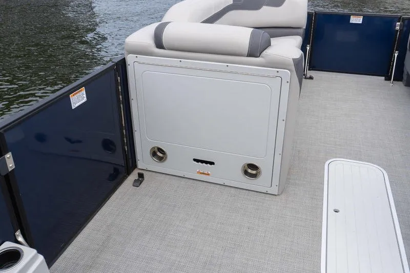 Slide: The Image of 2024 Sylvan L5 DLZ pontoon boat interior with seating and water view. - 14