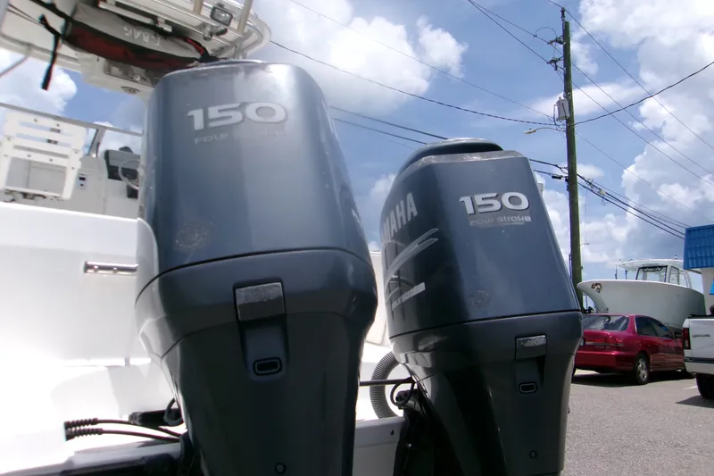 Slide: The Image of Twin Yamaha 150 four-stroke engines on a 2007 Century 2400 Walk-Around boat. - 4