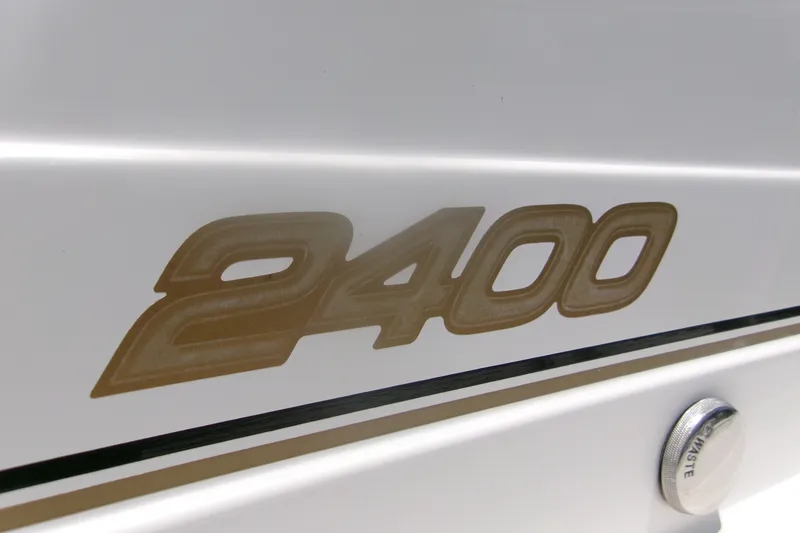 Slide: The Image of Century 2400 Walk-Around 2007 model emblem on white boat exterior. - 14
