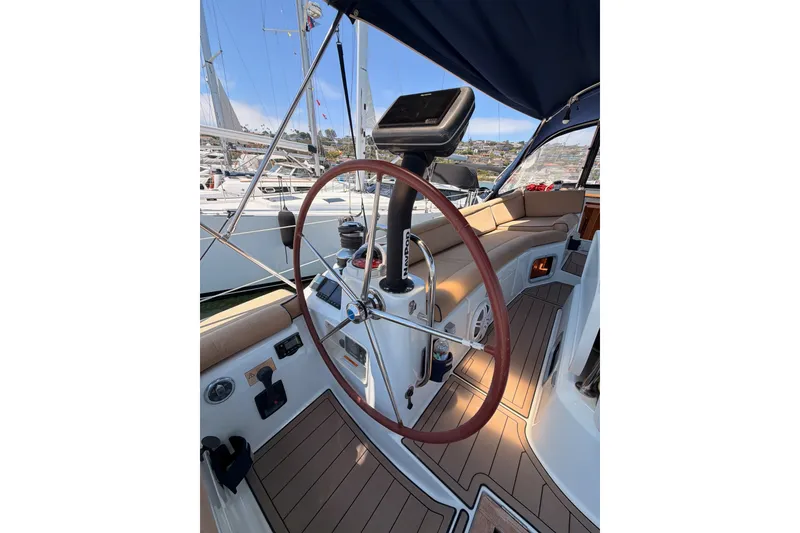 Slide: The Image of Steering wheel of 2009 Jeanneau Sun Odyssey 45 DS sailboat, docked in marina. - 19
