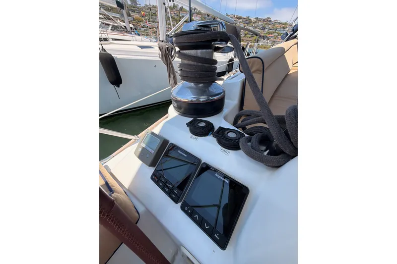 Slide: The Image of Cockpit controls of a 2009 Jeanneau Sun Odyssey 45 DS sailboat with navigation instruments. - 22