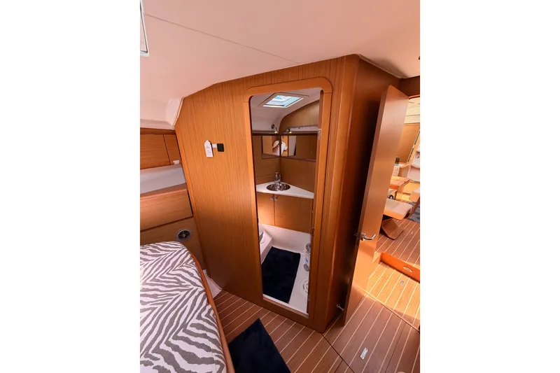 Slide: The Image of Interior of 2009 Jeanneau Sun Odyssey 45 DS yacht, featuring a cozy cabin and bathroom. - 69