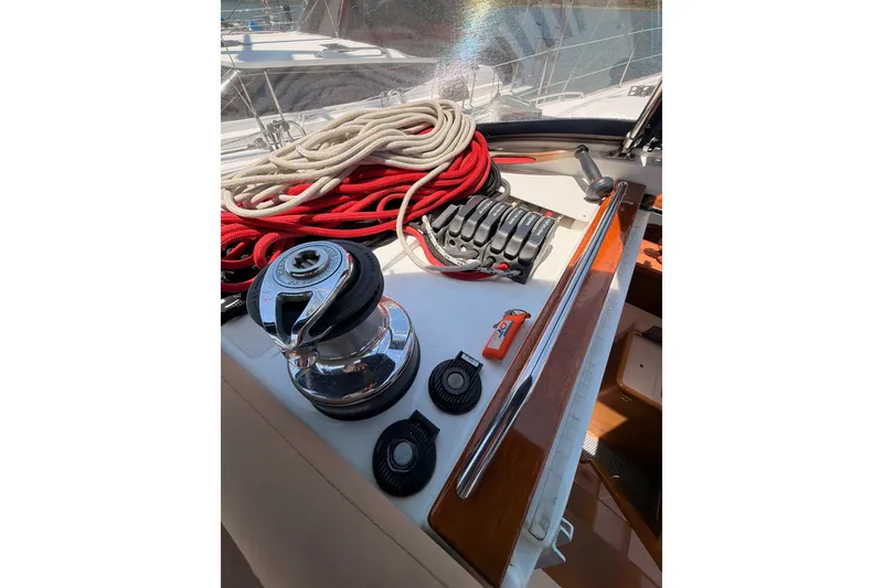 Slide: The Image of Deck of 2009 Jeanneau Sun Odyssey 45 DS with winch, ropes, and sailing equipment. - 39