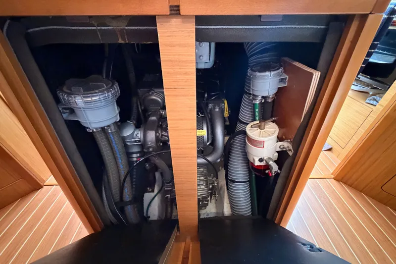 Slide: The Image of Engine compartment of 2009 Jeanneau Sun Odyssey 45 DS sailboat, showcasing mechanical components. - 94