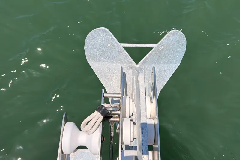 Slide: The Image of Anchor of 2009 Jeanneau Sun Odyssey 45 DS sailboat over green water. - 33