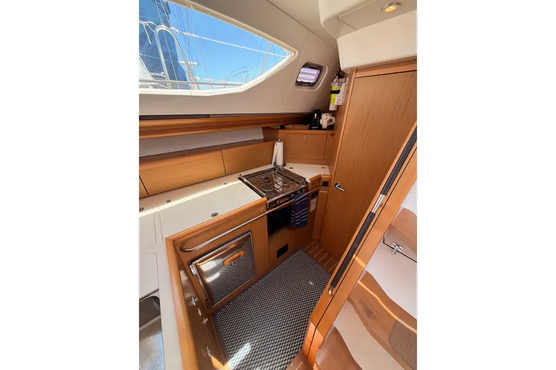 Slide: The Image of Interior of 2009 Jeanneau Sun Odyssey 45 DS yacht kitchen with wooden cabinetry. - 54