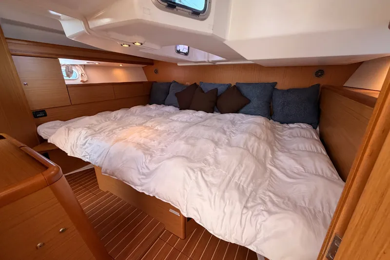 Slide: The Image of Luxurious cabin interior of 2009 Jeanneau Sun Odyssey 45 DS yacht with cozy bedding. - 84