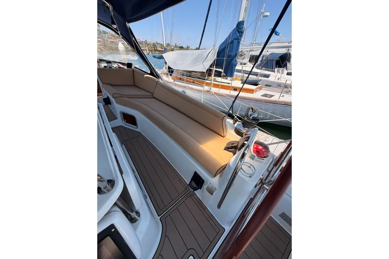 Slide: The Image of 2009 Jeanneau Sun Odyssey 45 DS sailboat cockpit with tan seating and marina view. - 25