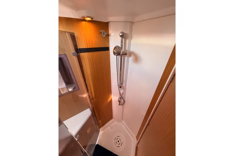 Slide: The Image of Shower area in 2009 Jeanneau Sun Odyssey 45 DS yacht, featuring sleek wood paneling. - 71