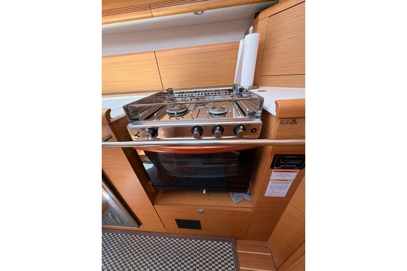 Slide: The Image of Galley kitchen in 2009 Jeanneau Sun Odyssey 45 DS yacht with stove and oven. - 55