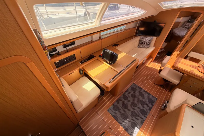 Slide: The Image of Interior of 2009 Jeanneau Sun Odyssey 45 DS yacht, featuring elegant wood finish and modern amenities. - 44