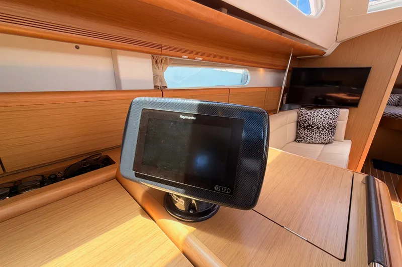 Slide: The Image of Interior of 2009 Jeanneau Sun Odyssey 45 DS yacht with navigation system and cozy seating. - 50