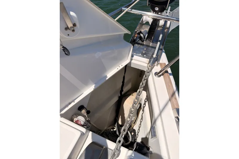 Slide: The Image of Anchor locker of 2009 Jeanneau Sun Odyssey 45 DS sailboat, featuring chain and storage. - 31