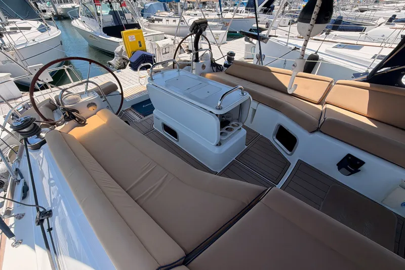Slide: The Image of Spacious cockpit of 2009 Jeanneau Sun Odyssey 45 DS sailboat with comfortable seating and steering wheel. - 36