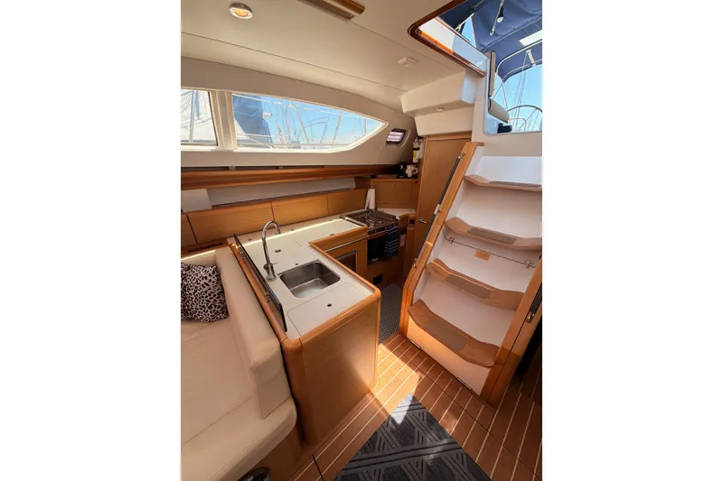 Slide: The Image of Interior of 2009 Jeanneau Sun Odyssey 45 DS yacht, featuring kitchen and stairs. - 53