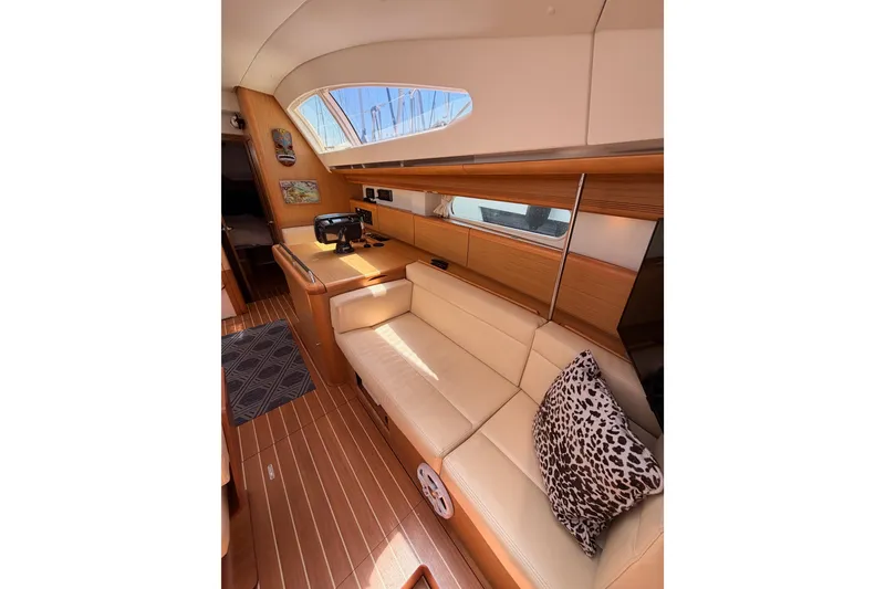 Slide: The Image of Interior of 2009 Jeanneau Sun Odyssey 45 DS yacht with elegant seating and wooden finishes. - 78