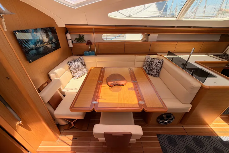 Slide: The Image of Luxurious interior of 2009 Jeanneau Sun Odyssey 45 DS yacht with elegant seating and dining area. - 62