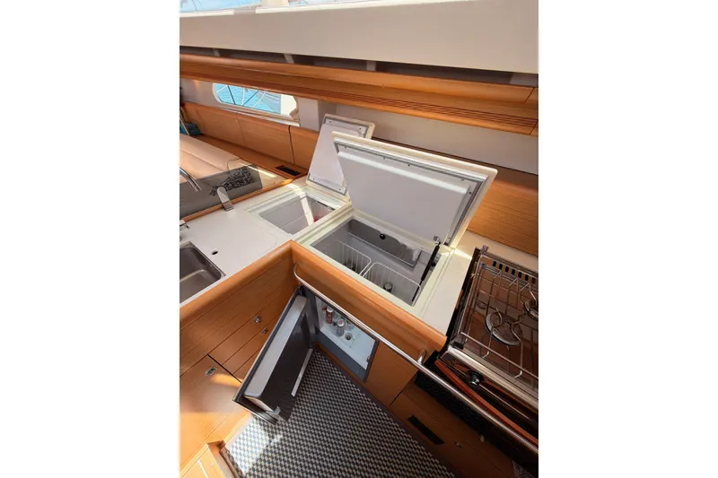 Slide: The Image of Interior of 2009 Jeanneau Sun Odyssey 45 DS yacht kitchen with open fridge and stove. - 57