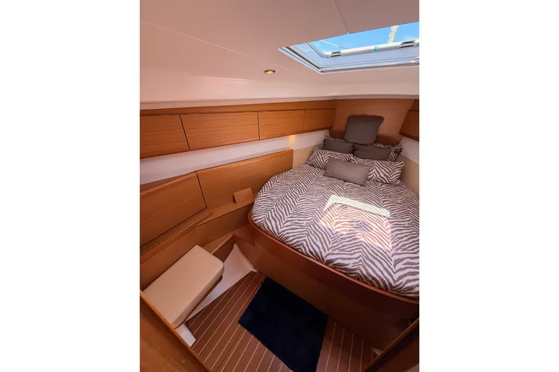 Slide: The Image of Cozy cabin interior of 2009 Jeanneau Sun Odyssey 45 DS with zebra-patterned bedding. - 73