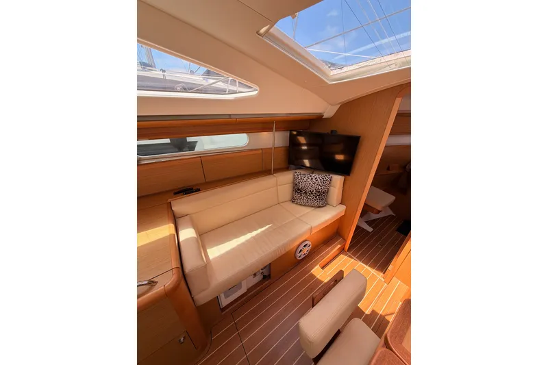 Slide: The Image of Interior of 2009 Jeanneau Sun Odyssey 45 DS yacht with beige seating and skylight. - 63